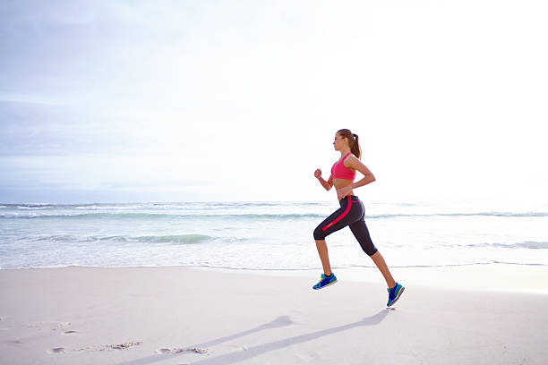 istock Enjoying her solitude run by the sea 510203793