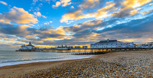 Eastbourne Pier and beach, East Sussex, England, UK Eastbourne Pier and beach at sunset, East Sussex, England, UK eastbourne pier photos stock pictures, royalty-free photos & images