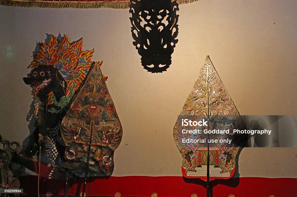 Indonesia: Javanese Shadow Puppet Theatre Yogyakarta, Indonesia - August 15, 2014: Backstage at a Javanese wayang kulit (shadow puppet) theatre in Yogyakarta. Performances of shadow puppet theatre are accompanied by a gamelan orchestra in Java. It is an ancient tradition throughout Java and all of Indonesia. Horizontal Stock Photo