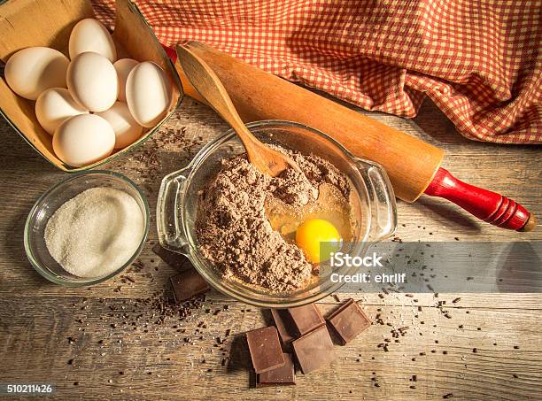 Chocolate Batter Surrounded By Fresh Ingredients Stock Photo - Download Image Now - Ingredient, Chocolate Cake, Mixing Bowl