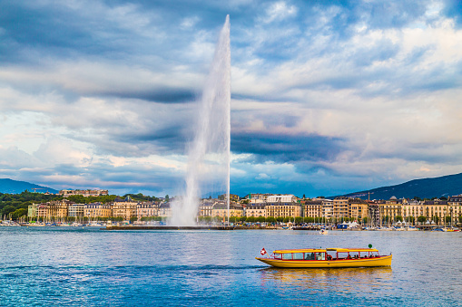 City of Geneva with Jet d'Eau fountain at sunset, Switzerland