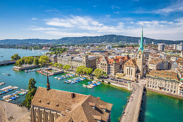 Historic city of Zürich with river Limmat, Switzerland Aerial view of Zürich city center with famous Fraumünster Church and river Limmat at Lake Zurich from Grossmünster Church, Canton of Zürich, Switzerland. zurich photos stock pictures, royalty-free photos & images