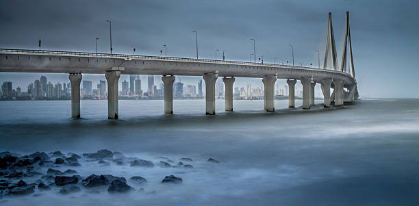 Sea link in Mumbai during Monsoon season Image has been shot with slow shutter speed to show motion blur of water during the monsoon rains arabian sea photos stock pictures, royalty-free photos & images