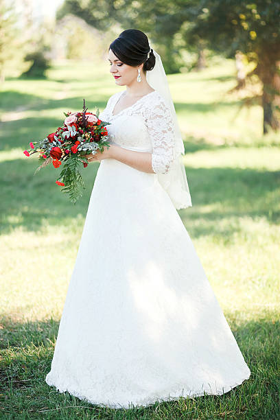 Bride on a background of trees, Fine portrait, full-length stock photo
