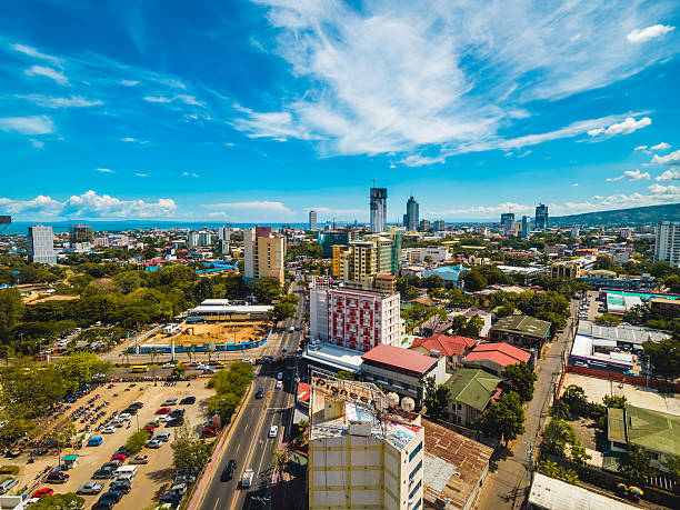 Clouds over Cebu City Cebu, Philippines - April 19, 2015: Clouds over a street in Cebu City, Philippines cebu province stock pictures, royalty-free photos & images