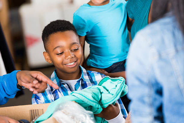 istock Boy donating coat to clothing drive 510220164