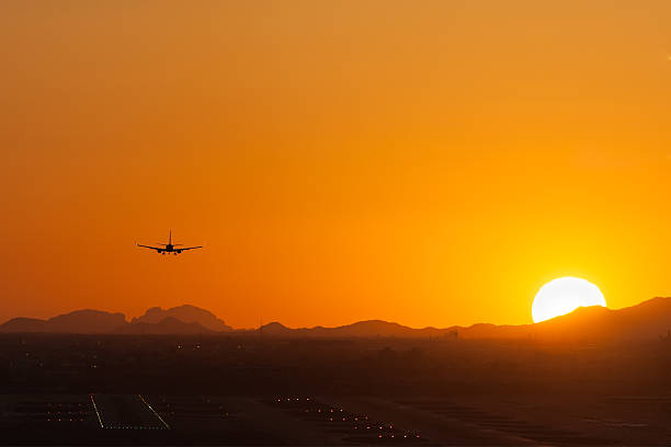istock Jet Plane Landing at Sunset 510220390