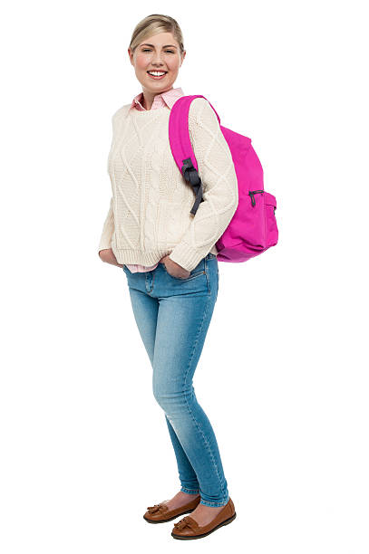 istock College student in winter wear posing with pink backpack 510222961