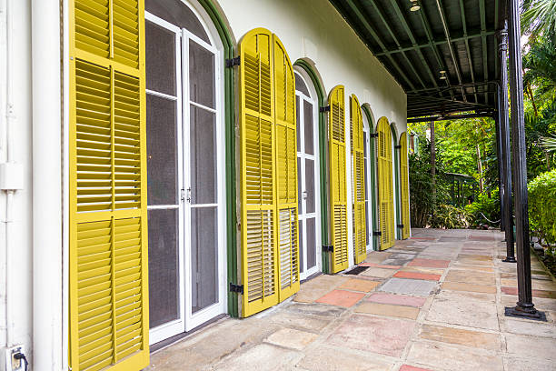 porch of  Ernest Hemmingways house in Key West Key West, USA - August 27, 2014: porch on the side of  Ernest Hemmingways house in Key West, USA. Ernest Hemingway lived and wrote here from 1931 to 1939. hemingway house stock pictures, royalty-free photos & images