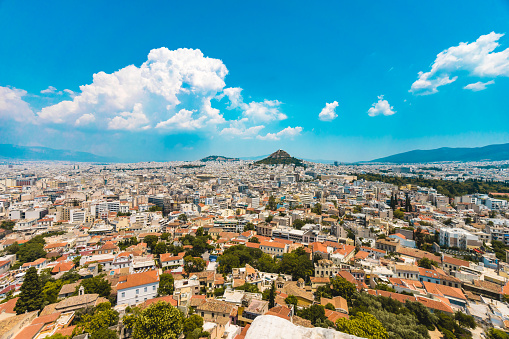 View of dense cityscape of Athens in Greece with Mount Lycabettus during sunset