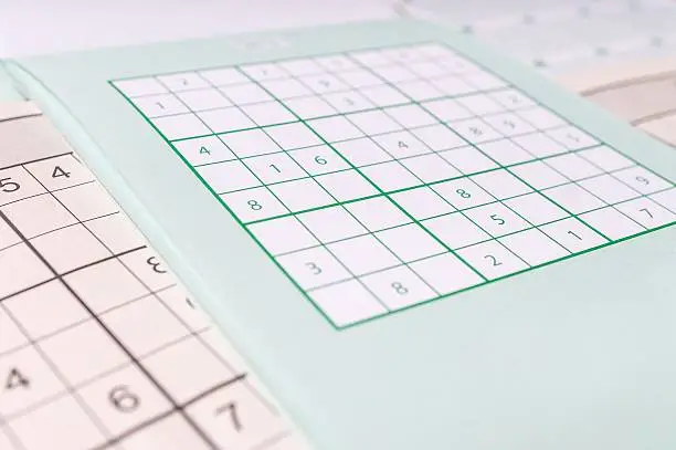 Photo of Sudoku crossword, close view. Brainteaser game.