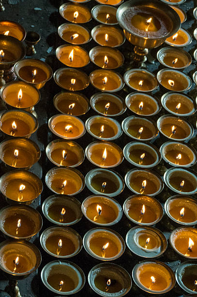 istock Lit candles for buddhist ceremony, vertical view 510226169