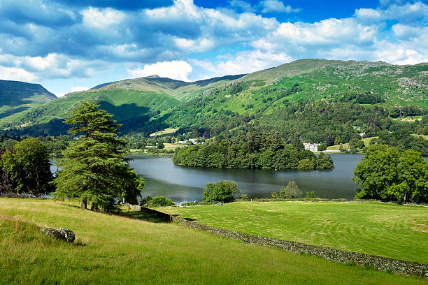 Grasmere village in English Lake District. Grasmere village in English Lake District. Beauty landscape with lake mountains and trees. grasmere stock pictures, royalty-free photos & images