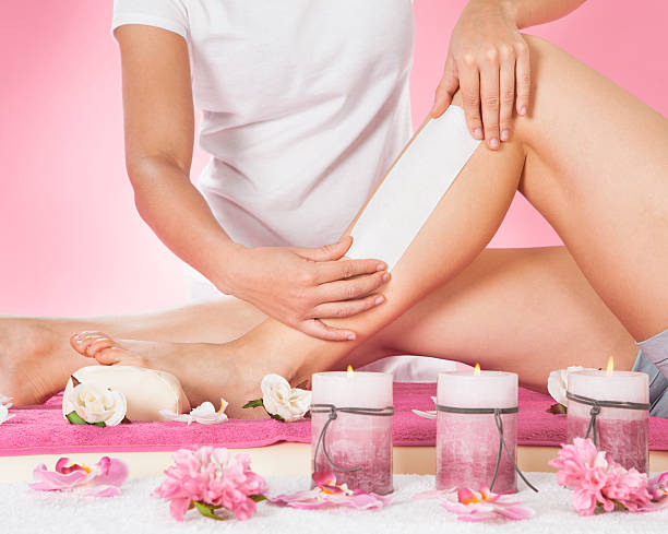 istock Therapist Waxing Customer's Leg At Spa 510227659