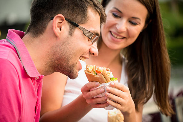 istock Couple eating outdoor 510228554