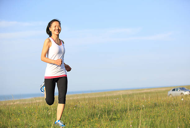 istock Runner athlete running on grassland 510228735
