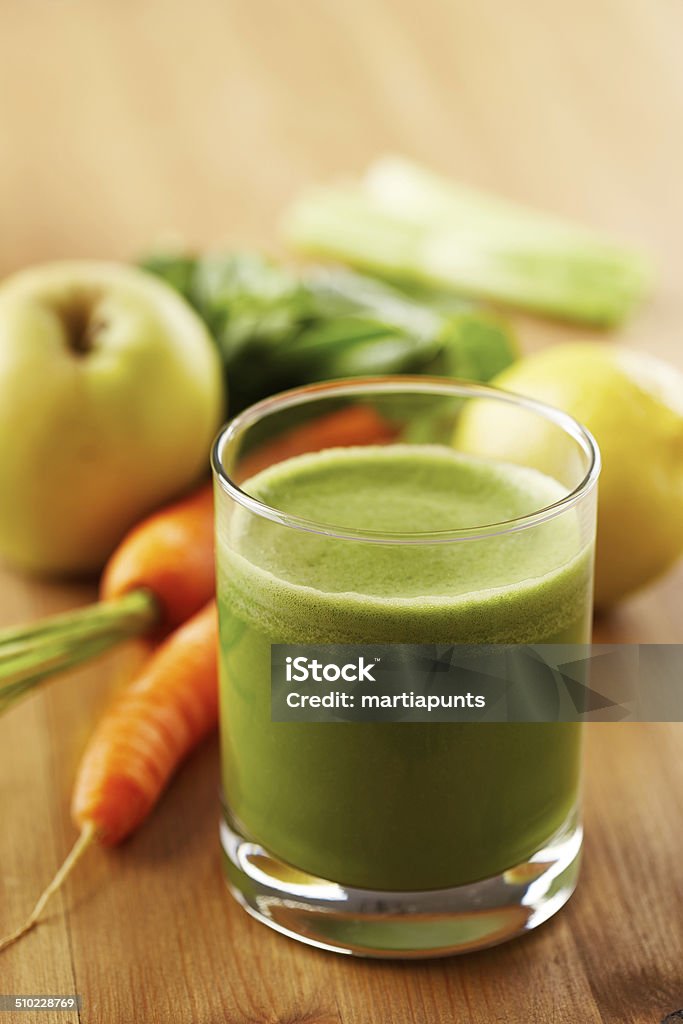 Homemade vegan green juice Homemade vegan green juice with fruit and vegetables Carrot Stock Photo