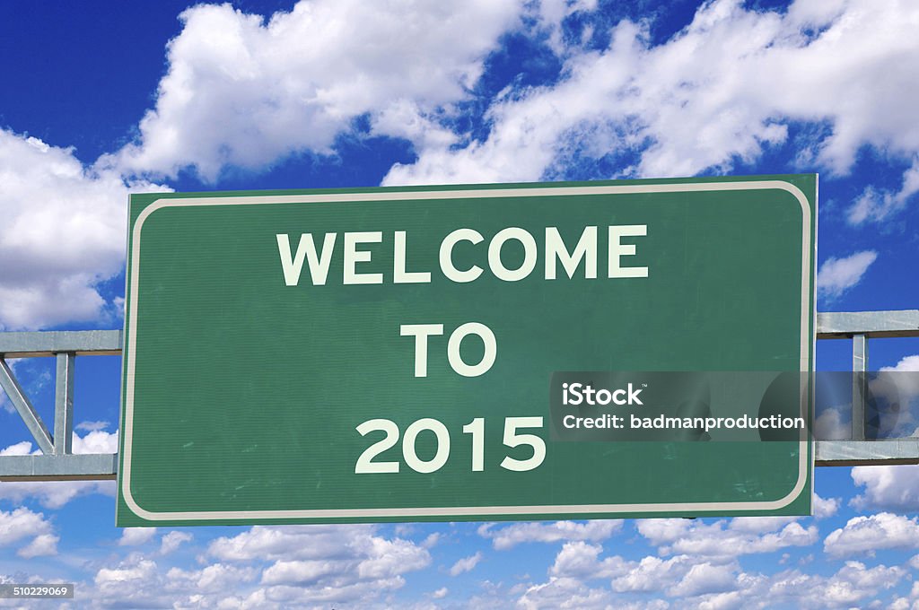 Welcome to 2014 Welcome to 2015 on the sign with sky in background 2015 Stock Photo