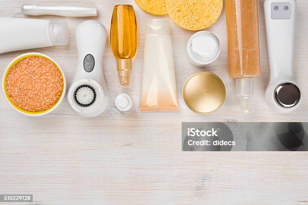 Beauty Treatment Products On Wooden Background With Copyspace At Bottom Stock Photo - Download Image Now