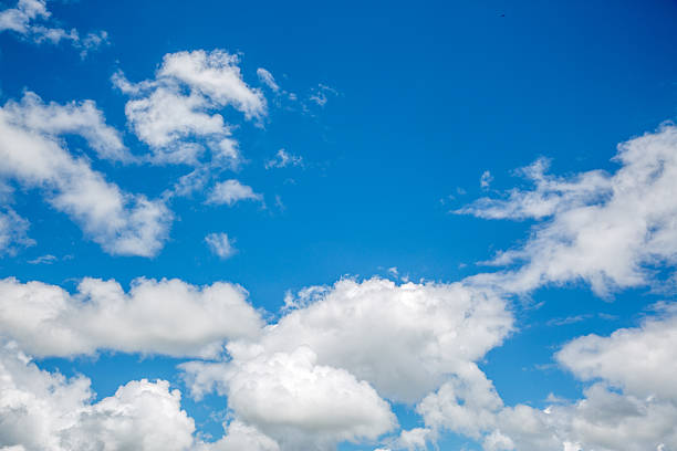 istock Blue sky breaking through white cumulus clouds 510231022