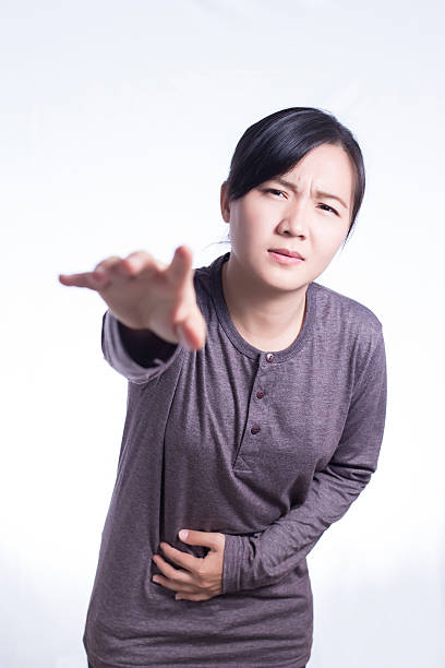 istock Woman Has Stomach Ache on Isolated White Background 510231126