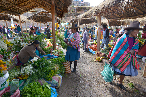 Chinchero, Peru - September 20, 2015: Unidentified women with the traditional clothes in Chinchero market on September 20, 2015 in Peru.