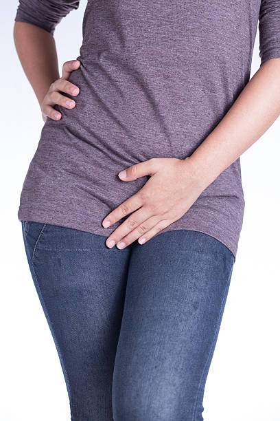 istock Woman with Hands Holding Her Crotch 510232972