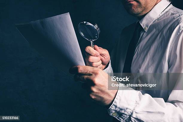 Tax Inspector Doing Financial Auditing Businessman Reading Cont Stock Photo - Download Image Now