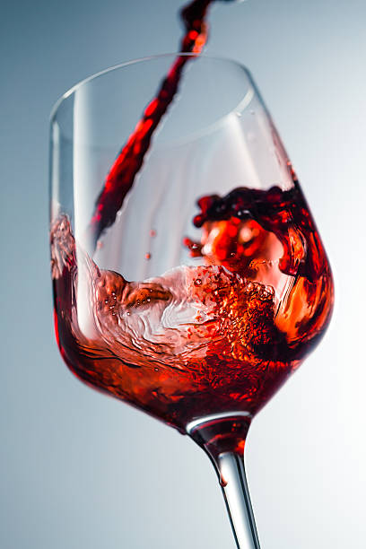istock Red wine pouring in glass 510234232