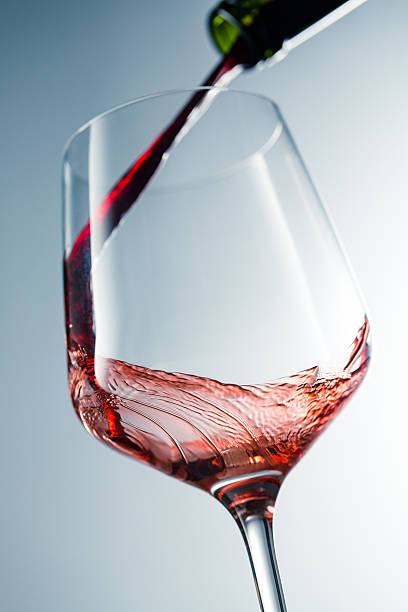 istock Red wine pouring in glass 510234318