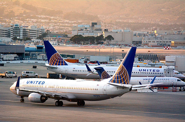 United Airlines planes in San Francisco International Airport San Francisco, California, USA - May 20, 2015: United Airlines planes in San Francisco International Airport.It is the world's largest airline when measured by number of destinations served. boeing 737 photos stock pictures, royalty-free photos & images