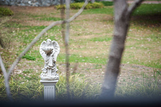 istock Angel statue in nature place in soft light 510237420