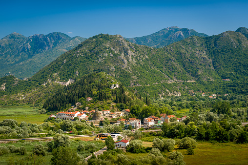 Aerial view of Virpazar town, old fortress Besac and mountains of Skadar lake national park. Montenegro landscapes.