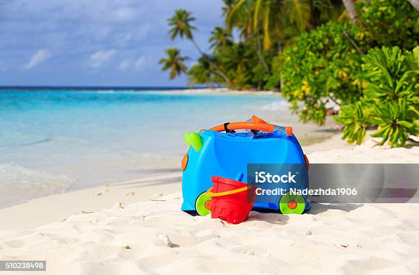 Kids Suitcase Toys And Snorkel Equipment At Beach Stock Photo - Download Image Now - Bag, Beach, Family