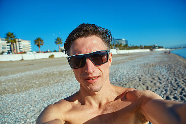 istock young man on the beach 510240164