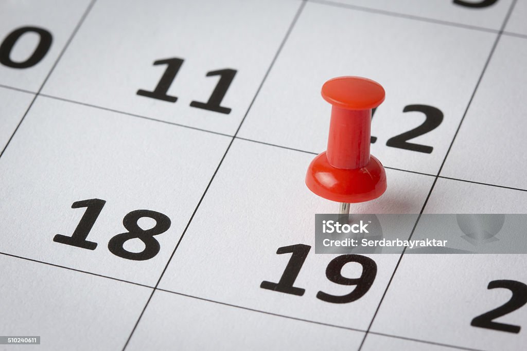 Appointments marked on calendar Concept image of a calendar with red push pins. Available in high resolution Calendar Stock Photo