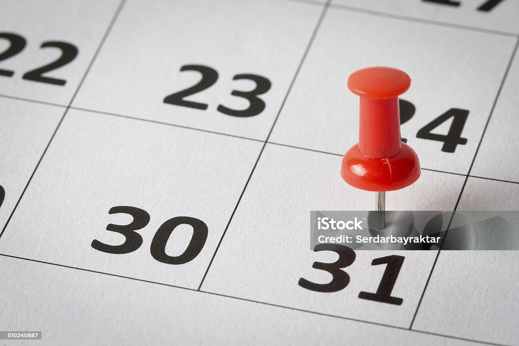 Appointments marked on calendar Concept image of a calendar with red push pins. Available in high resolution Calendar Stock Photo