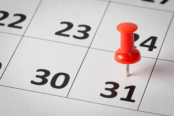 Appointments marked on calendar Concept image of a calendar with red push pins. Available in high resolution number 31 stock pictures, royalty-free photos & images