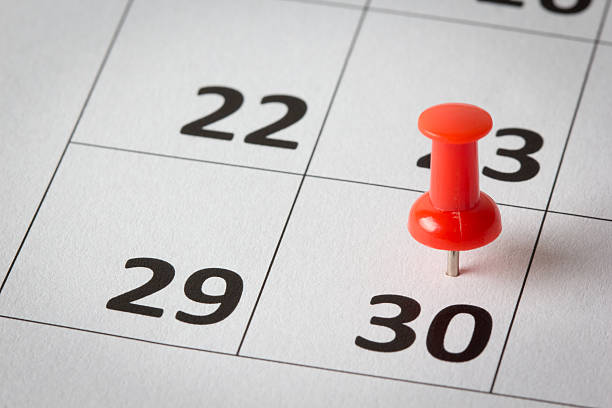 Appointments marked on calendar Concept image of a calendar with red push pins. Available in high resolution number 30 stock pictures, royalty-free photos & images