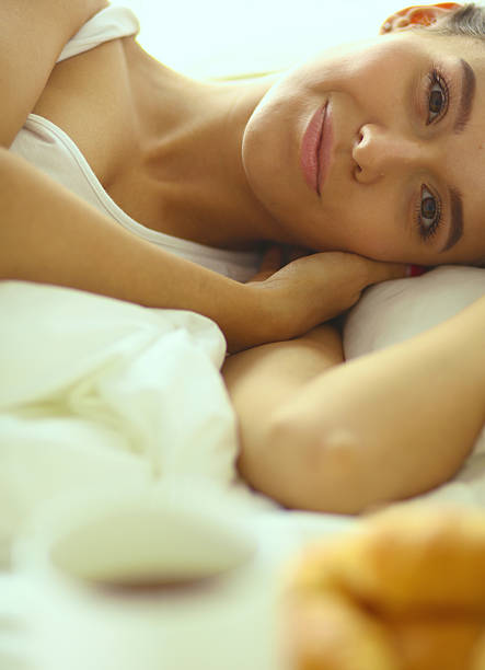istock Young beautiful woman lying in bed 510241450