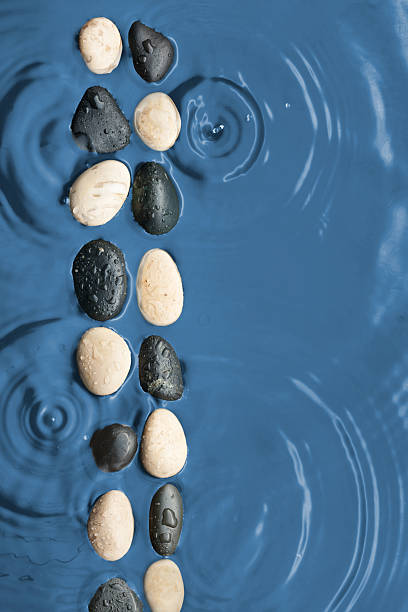 istock Black and white stones in the water 510241631