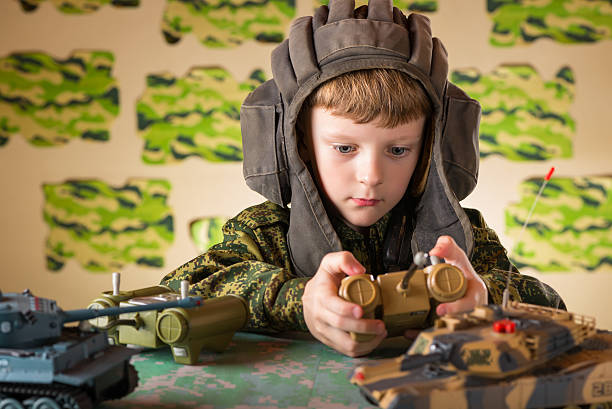 istock Boy playing toy military tank 510242076