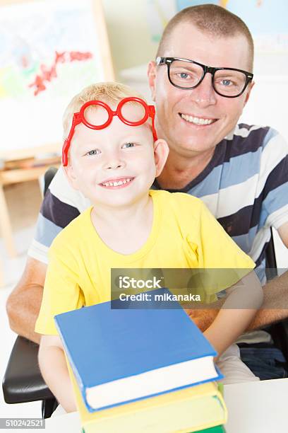 Disable Father Reading With Little Son Stock Photo - Download Image Now - 4-5 Years, Argyle, Aspirations