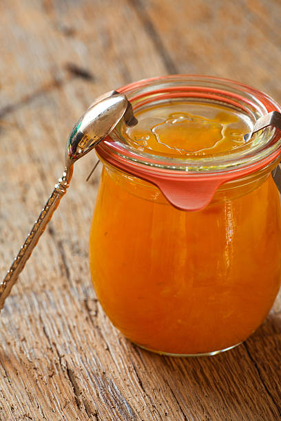 istock Melon jam in preserving jar with a spoon 510243407