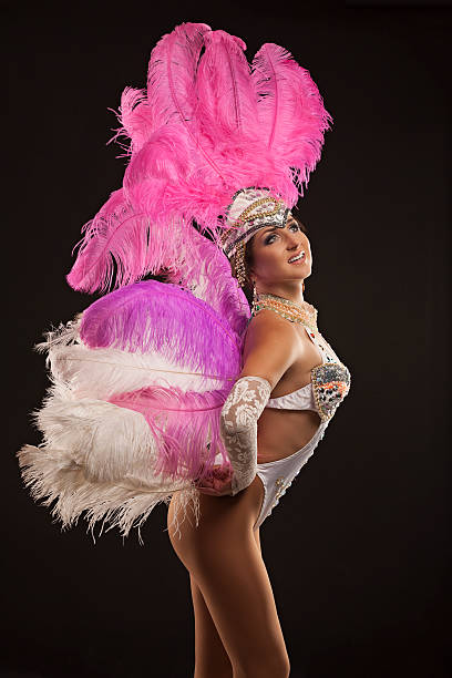 istock Burlesque dancer in white dress with pink plumage 510243553