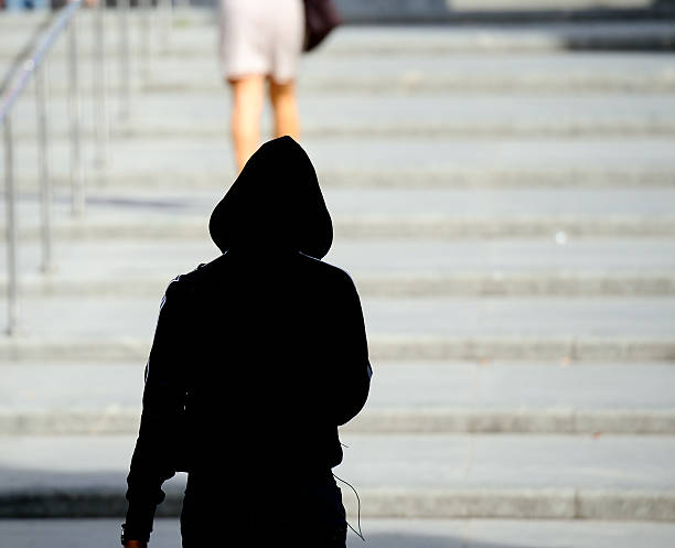 Woman being followed Woman being followed stalker stock pictures, royalty-free photos & images