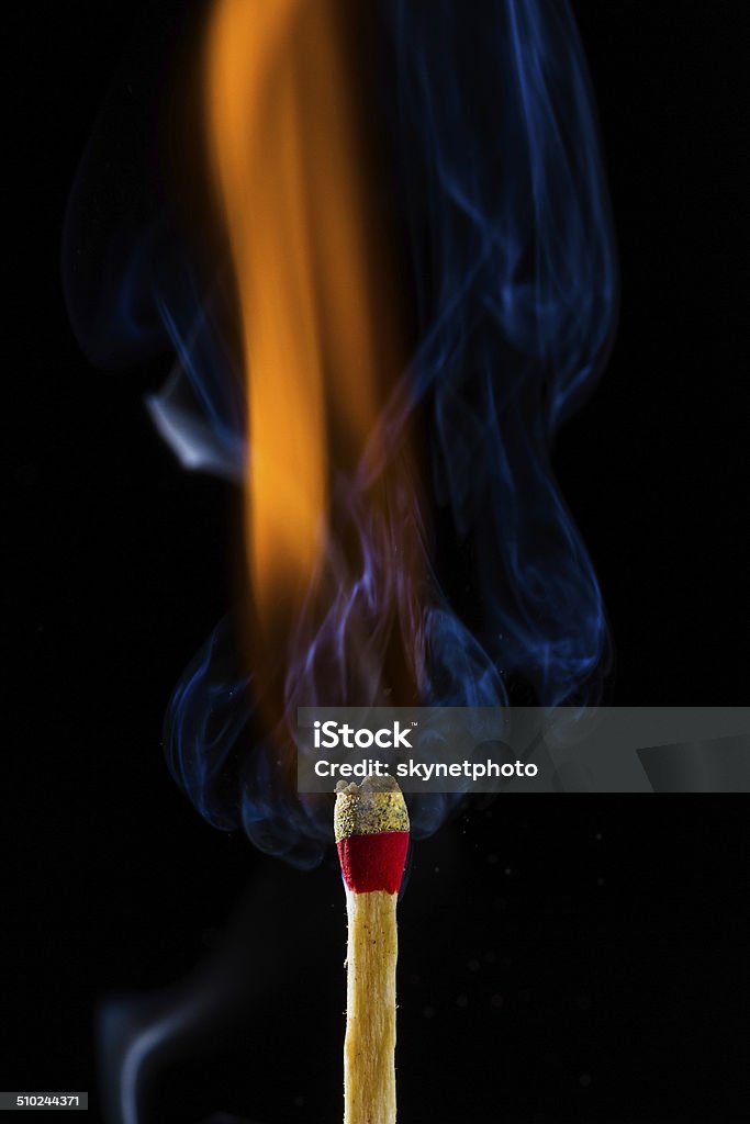 Burning matchstick Burning matchstick on black background Arson Stock Photo