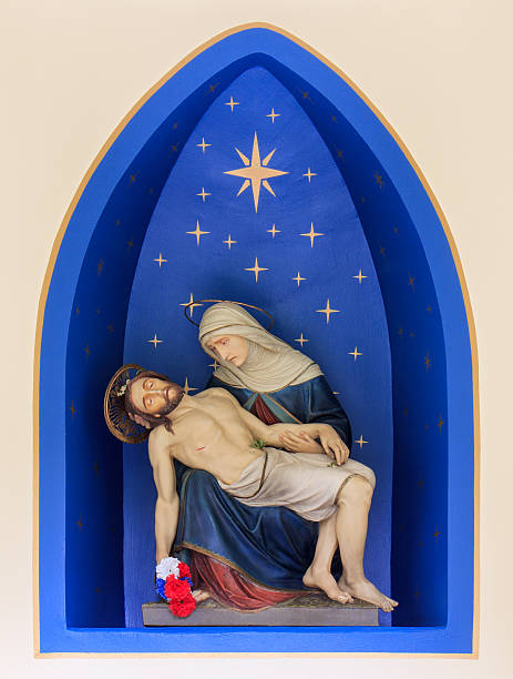 Pieta Inside of a small cemetery chapel at Mount Angel Abbey in Oregon. pieta stock pictures, royalty-free photos & images