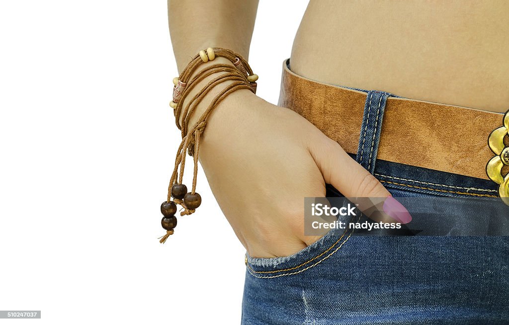 hand with a bracelet in a pocket of jeans Abdomen Stock Photo