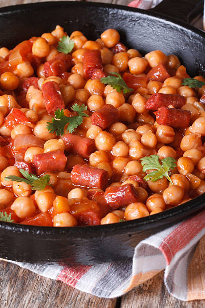 istock Chickpeas with chorizo and vegetables in tomato sauce 510247567